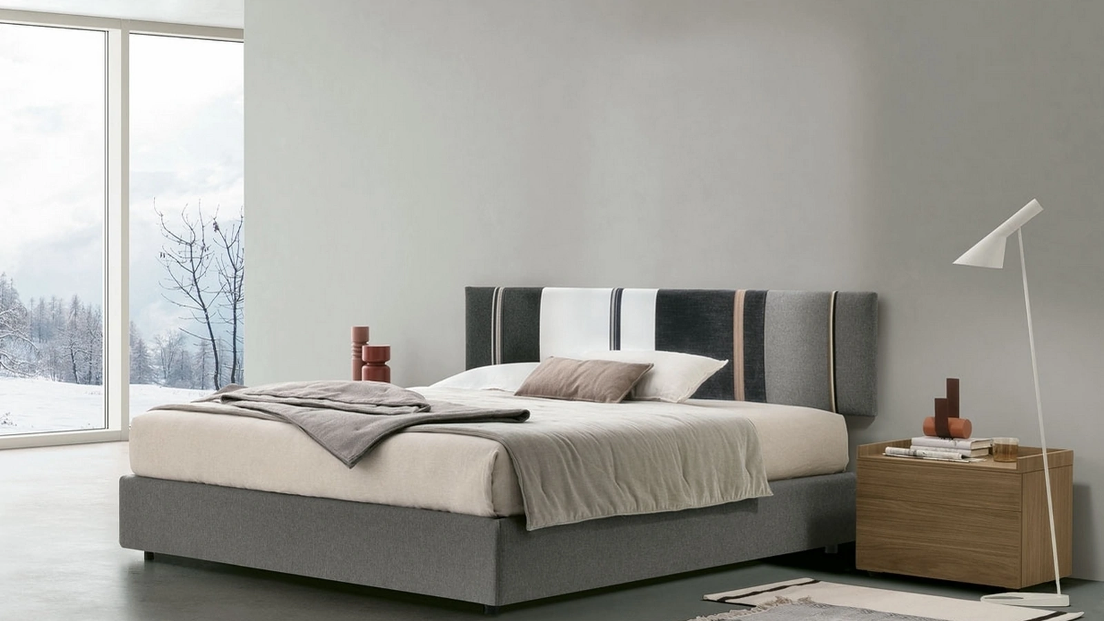 Letto sommier Diagonal con box contenitore e pannello testiera di Tomasella